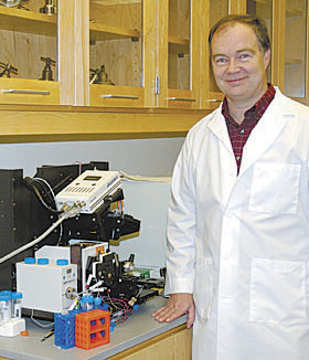 Gerry Baily pours fuel into the BioBus