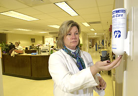 Nancy Dupont, a nurse, uses a water-less hand sterilizer.