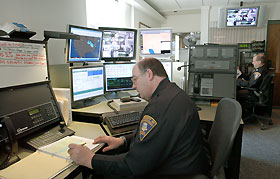 John McClure, foreground, and Alex Mrazik Jr., dispatchers, in the UConn Police/Fire Communications Center