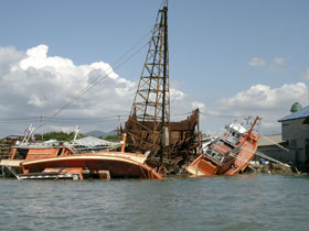 Destruction of commercial fishing boats in one of the harbors of Thailand's Phuket province