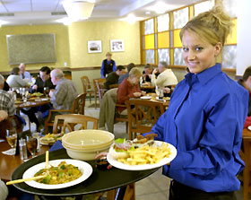 Molly Blizman, a senior, serves a practice lunch at Chuck & Augie's Restaurant.