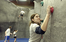 Katie Ringel, a senior, climbs the wall.