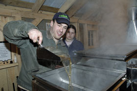 Geoffrey Picard, vice president of the Forestry and Wildlife Club, makes maple syrup