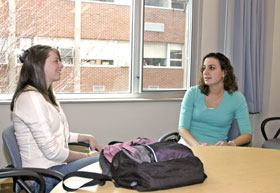 Ashley Gaedt, left, a freshman majoring in physical therapy, talks with Andrea Goggin, a senior majoring in family studies.