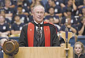 Provost Peter J. Nicholls addresses freshmen and their families during Convocation in Gampel Pavilion on August 26. 