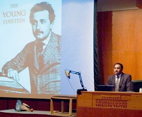 Physics professor Ron Mallett gives a lecture on Einstein in Konover Auditorium as part of the Einstein Centenniel series.