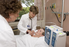 Patricia Dugger, center, and Shelley Dietz are 'action nurses' at the UConn Health Center.