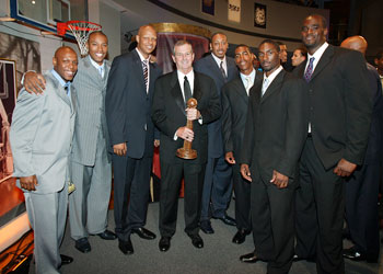 After his induction into the Basketball Hall of Fame in Springfield, Mass., on Sept. 9, Jim Calhoun, head coach of men's basketball, stands surrounded by former UConn standouts, from left, Taliek Brown, Caron Butler, Charlie Villanueva, Donyell Marshall, Kevin Ollie, Ben Gordon, and Emeka Okafor.