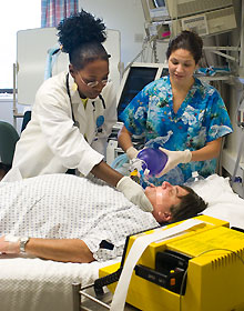 Respiratory therapists Bettye Warren, left, and Vanessa Saucier demonstrate a procedure during a simulation exercise at the Health Center.