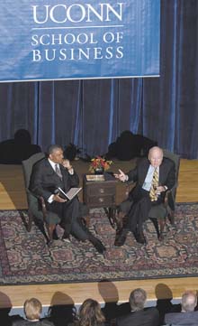 Former CEO of General Electric Jack Welch, right, speaks at the Student Union Theatre. At left is Curt Hunter, dean of the business school.