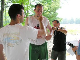 Researchers from the kinesiology department's Human Performance Lab conducting a study on heat and exertion. From left are undergraduate Neal Glaviano, doctoral student Jakob Vingren, and Professor Larry Armstrong.
