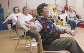 Seniors exercise at the Health Center, as part of a study on bone strength and balance.