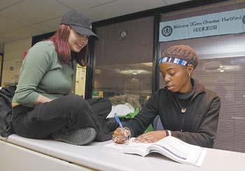 Valentina Mehmeti, left, and Jennine Bajjo, both freshmen, study at the Edith and Harry Gampel Student Center at the Greater Hartford Campus.