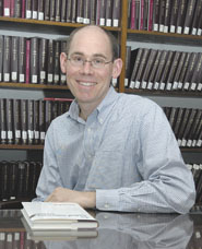 Thomas Baker, the Connecticut Mutual Professor of Law and director of the law school's Insurance Law Center, with his new book on medical malpractice.