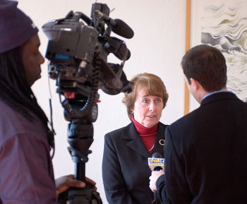 Barbara Jacobs, assistant professor of nursing, is interviewed by a television reporter during a statewide summit on the nursing shortage February 28.
