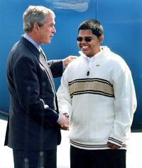 President Bush congratulates Amargeet Singh , a high school student who volunteers on behalf of the Health Center, last Wednesday morning in New Haven.