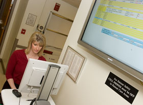 Patricia Bernier, a nurse manager, uses a computer in the Emergency Department at the UConn Health Center.