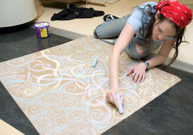 Stephanie Santso, a senior majoring in engineering, creates a chalk drawing for Arts Fest 2006 at the Student Union on April 22. 