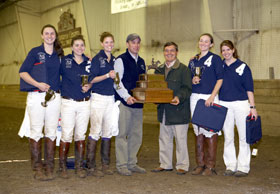 The Women’s Polo team with the 2006 National Intercollegiate Polo Championship trophy. From left, Kelly Wisner, Meaghan Scanlon, Amy Wisehart, Coach Matt Syme, Peter Rizzo of the U.S. Polo Association, Elizabeth Rockwell, and Lindsey Burbank.