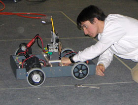 Theodore Janeczko of Farmington High School works on a robotics project. Two UConn students at the Greater Hartford Campus were mentors for the project.