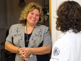Husky Hero Cathy Sonnenberg, left, speaks with Jeanine Suchecki, an assistant professor of surgery at the Health Center.