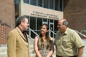 Psychology professor David Kenny, left, and Professor Seth Kalichman, the two principal investigators on a new NIH training grant, with graduate student Lisa Eaton, who will be one of the first to work in the grant program.