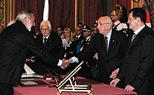 Gino Nicolais, left, a long-time adjunct professor of polymer science at UConn, shakes hands with the President of Italy, Romano Prodi, after joining the Italian government as Minister of Innovation and Technologies.