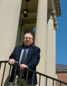 Bruce Stave, Board of Trustees Distinguished Professor of History Emeritus and author of a new history of UConn, on the steps of the Wilbur Cross Building.