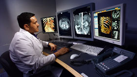 Dr. Naveed Alvi, a radiologist, uses the picture archiving communications system at the Health Center. The system captures and stores diagnostic images so they can be easily accessed and compared with previous images.