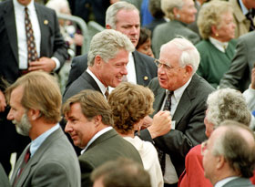 Irving Saslow, center right, a former university trustee who died Sept. 5, greets President Bill Clinton after the dedication of the Thomas J. Dodd Research Center, in this file photo from 1995.