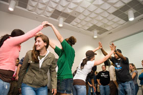 Students are learning the history of different cultural groups in America through the performance of folk songs, in a general education class taught by music professor Mary Ellen Junda.