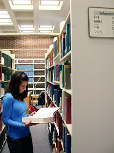 Emily Hoffman, a sophomore majoring in communications disorders, in the reference section of Homer Babbidge Library.