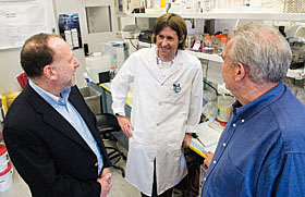 Kevin Jensen, center, a graduate student at the Health Center, has a dual fellowship in the labs of Drs. Henry Kranzler, left, and Henry Furneaux. He is studying microRNA and its implications for substance dependence.