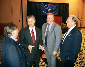 Don Williams, second from left, state senate president pro tempore, speaks with Ed Marth, executive director of the AAUP, during UCPEA's annual legislative luncheon. They are joined by Pat Sheehan, chair of the UConn Advocates, second from right, and Kevin Fahey, president of UCPEA.