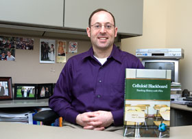 Alan Marcus, an assistant professor of curriculum and instruction, with Celluloid Blackboard, the book he edited about teaching history through movies.