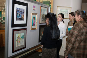 Faculty, staff, and students at the Health Center turned out to view a recent exhibit of works by their colleagues, Art, An Expression of Diversity. From left, Tina Liang, Polina Scherbatov, Nikolina Arthur, and Sue Donohue.