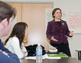 Betsy Cracco, right, of the Women’s Center, addresses a class as part of the Don’t Cancel Your Class program.