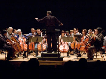 Jeffrey Renshaw conducts UConn cellists at von der Mehden Recital Hall during the recent Cello Festival.