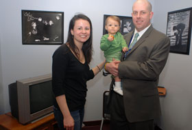 From left, Diana, Caroline, and Eric Baim at the dedication of the Family Resource Room in the Health Center’s Neonatal Intensive Care Unit (NICU), where Caroline started her life. Her parents now assist families of babies in the NICU, through an initiative with the March of Dimes.