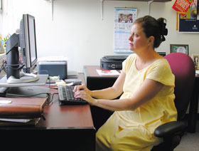 Melissa Bray, associate professor of school psychology, at her office in Gentry Building. Bray is studying psychological techniques to help school children with asthma.