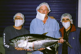 Researchers hold a large tuna. From left, Barry Costa-Pierce of Rhode Island Sea Grant, Charles Yarish of UConn’s Department of Ecology and Evolutionary Biology, and Jose Zertuche of the Universidad Autonoma Baja California.