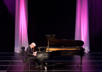 Pianist Neal Larrabee, associate professor of music, performs during an inaugural concert on March 18 celebrating the new chamber stage at the Jorgensen Center for the Performing Arts.