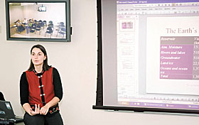 Penny Vlahos, assistant research professor of marine sciences, gives a lecture from the Storrs  campus using interactive television.