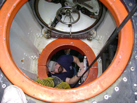 Graduate student David Robinson emerges from the US Navy’s NR-1 nuclear-powered submarine. The sub is used for underwater research.