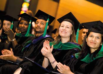 Medical students applaud during the Health Center commencement ceremony at the Connecticut Convention Center in Hartford.
