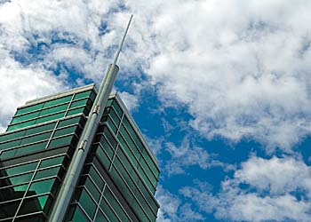 The peak of the Information Technologies Engineering Building against a cloudy sky.