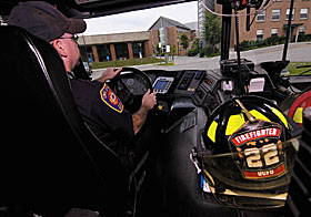 UConn firefighter Patrick Selburg drives across campus to make a routine safety check.
