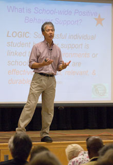 Professor George Sugai, director of UConn’s Center for Behavioral Education and Research, speaks to teachers at Illing Middle School in Manchester.