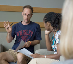 Barry Schreier, director of Counseling and Mental Health Services, leads a small group discussion on helping students in crisis. Also shown is Kimeta Straker, an academic counselor with ACES.
