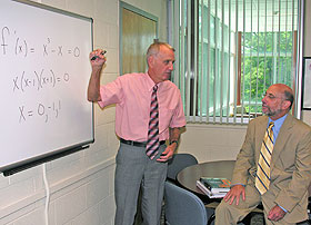 Charles Vinsonhaler, left, a recently retired professor of mathematics, and Tom DeFranco, associate dean of the Neag School of Education, at the Center for Research in Mathematics Education.